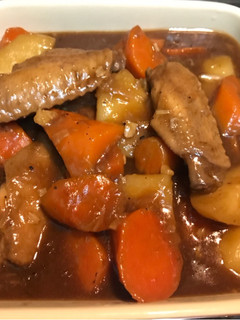 A picture of Chicken wing, potatoes and carrots with oyster sauce.