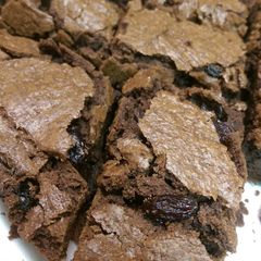 A picture of Brownies with raisins.