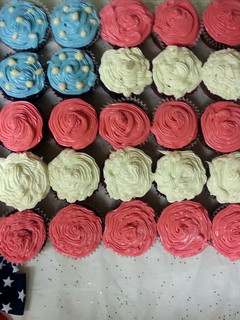 A picture of Red Velvet Cupcakes with White Chocolate Filling & Cream Cheese Icing - 4th of July.