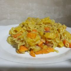 A picture of Indomine with ripe plantain and carrots.