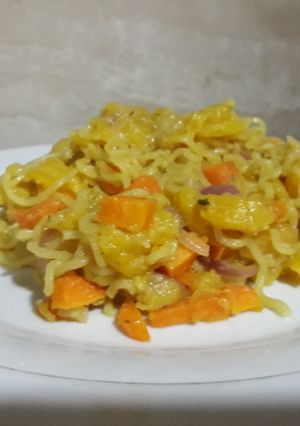 A picture of Indomine with ripe plantain and carrots.