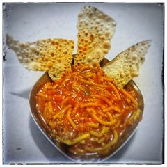 A picture of Leave Sev Tomato Curry.