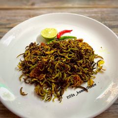 A picture of Lau Khosa Posto Bhaja aka Roasted Bottle Gourd Peel.