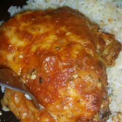 A picture of Cheese crusted tomato chicken thighs.