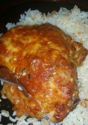 A picture of Cheese crusted tomato chicken thighs.