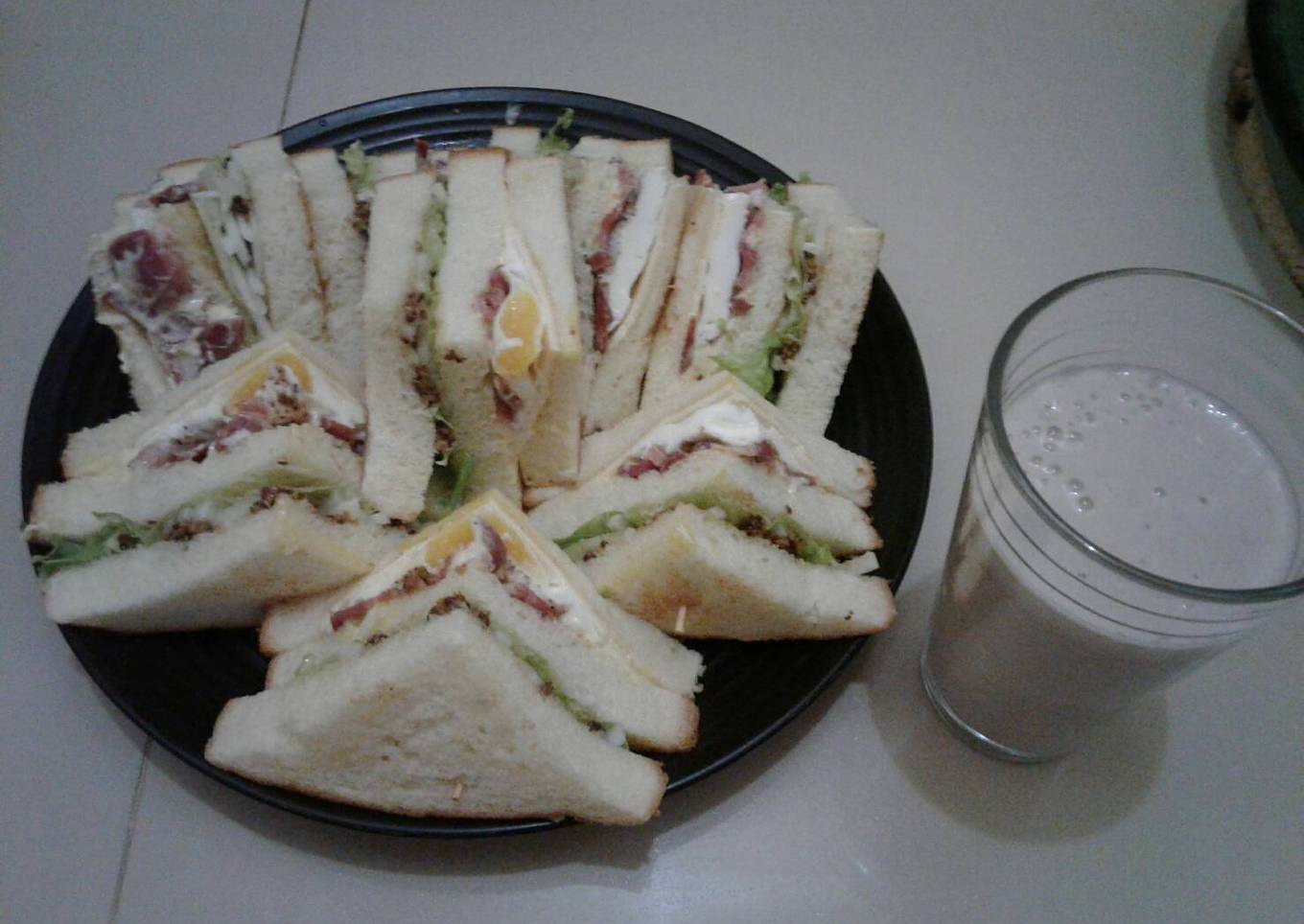 Ham sandwiches and banana juice