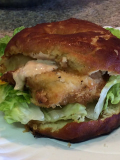 A picture of Buffalo Chicken On Pretzel Bun.