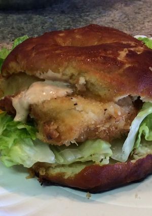 A picture of Buffalo Chicken On Pretzel Bun.