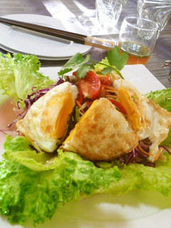 A picture of Thai-style Salad with Vegetables and a Sunny-side Up.