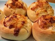 A picture of baked bread cheese rolls