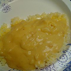 A picture of Buttered rice with gravy.