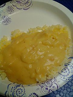 A picture of Buttered rice with gravy.