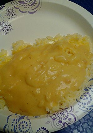 A picture of Buttered rice with gravy.