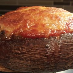 A picture of Veggie stuffed portebella mushroom.