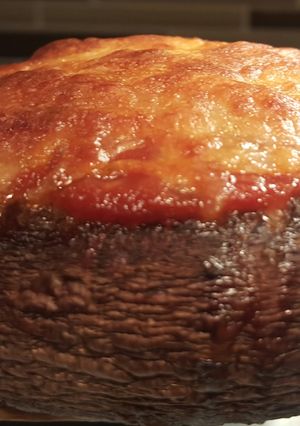 A picture of Veggie stuffed portebella mushroom.