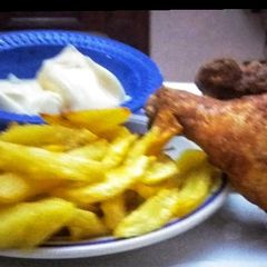 A picture of Spicy Chicken with fries.