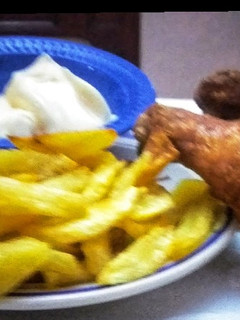 A picture of Spicy Chicken with fries.