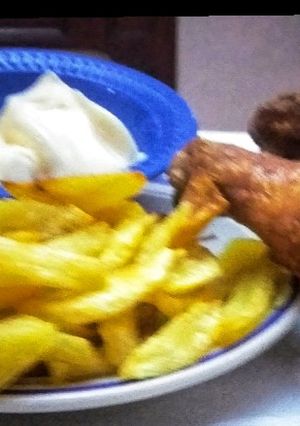 A picture of Spicy Chicken with fries.