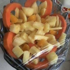 A picture of Pineapple with papaya salad.
