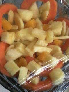 A picture of Pineapple with papaya salad.