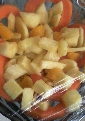 A picture of Pineapple with papaya salad.