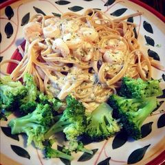 A picture of Creamy Pesto Alfredo With Shrimp and Linguini.