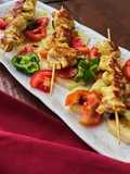 Spiedini di pollo speziati