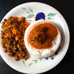 Rice and stew served with veggie beans A picture of Rice and stew served with veggie beans.