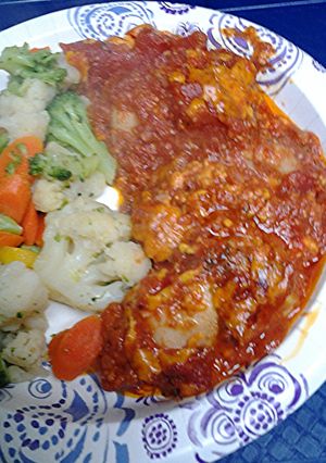 A picture of Stewed chicken in tomatoes.