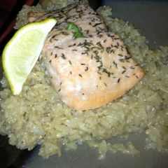 A picture of salmon and brown rice.