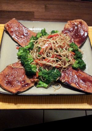 A picture of vegan honey barbaque fish with vegetable lomain noodles.