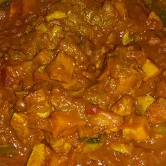 A picture of Chicken and mushroom curry.