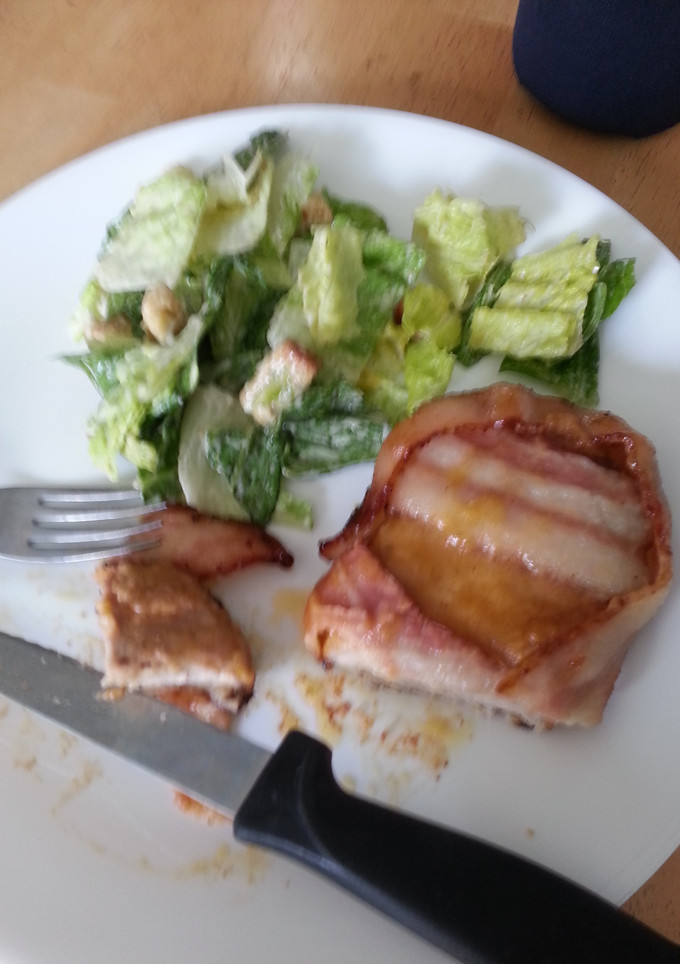 A picture of Bacon wrapped pork chops.