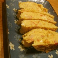 A picture of Umami-Rich Fluffy Dashimaki Tamago With Crabsticks and Mentsuyu Sauce.