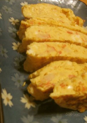 A picture of Umami-Rich Fluffy Dashimaki Tamago With Crabsticks and Mentsuyu Sauce.
