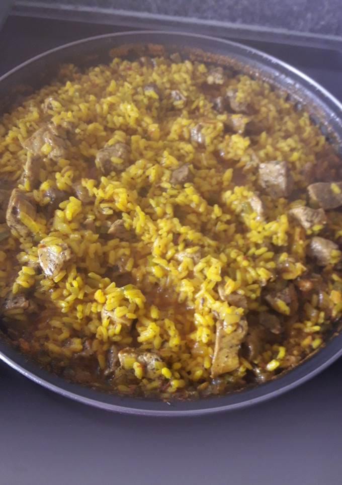 Una foto de Paella de cerdo