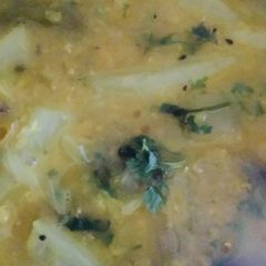 A picture of Masoor daal with raw papaya.