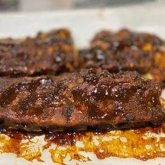 A picture of Stove Top Pressure Cooker Baby Back Ribs — BBQ sauce.