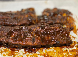 A picture of Stove Top Pressure Cooker Baby Back Ribs — BBQ sauce.