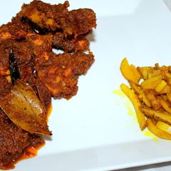 A picture of Spicy dry chicken or Bengali kosha murgir mangsho.