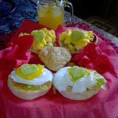 A picture of Pouched eggs with homemade turmeric and cream cheese sauce on english muffin.