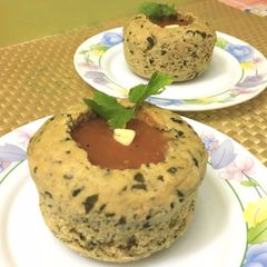 A picture of Garlic Fenugreek Leaves Bread Bowl with Carrot & Tomato Soup.
