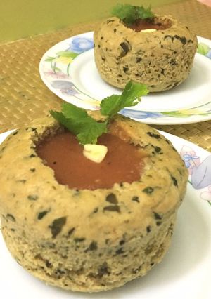 A picture of Garlic Fenugreek Leaves Bread Bowl with Carrot & Tomato Soup.