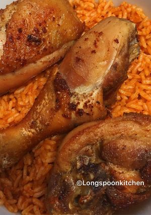 A picture of Jollof rice with fried chicken.