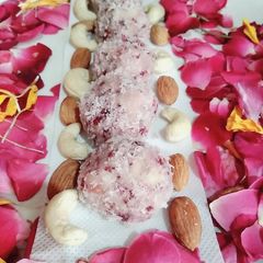 A picture of Rose coconut ladoo.