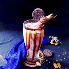A picture of Choco vermicelli mocktail with cocoa cubes.