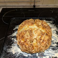 A picture of Soda bread with cheese and spring onions.