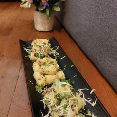 A picture of Cheese green/schezwan chutney Khandvi.
