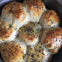 A picture of Bread Rolls with Stuffed Potatoes.