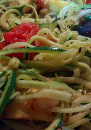 A picture of Spiralised courgette with baby prawns, roast baby tomatoes and pineapple in chilli pesto.